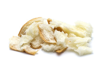 Slice of fresh bread and crumbs isolated on white background.