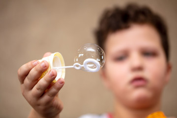Soap bubble in the hand.