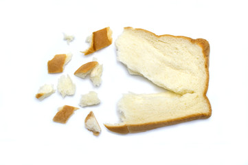 Slice of fresh bread and broken with crumbs isolated on white background.