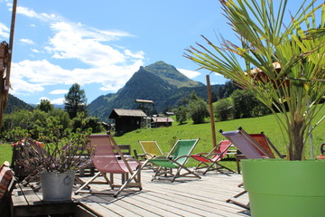 Deck chairs in a garden in the French Alps