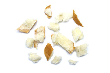 Slice of fresh bread and crumbs isolated on white background.