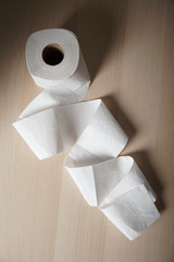 Soft hygienic toilet paper on wood background