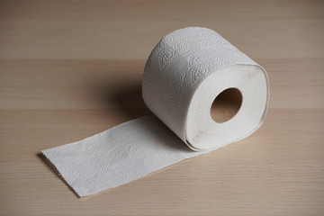 Soft hygienic toilet paper on wood background