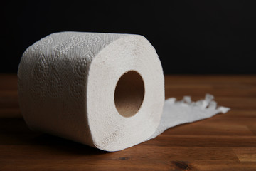 Soft hygienic toilet paper on wood background