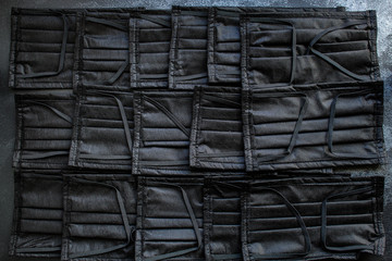 face masks for virus protection, health safety black color. background, top view. copy space for text