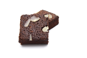 Chocolate brownie with sliced almond nuts toppings isolated on white background.