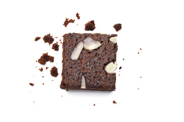 Chocolate brownie with sliced almond nuts toppings crumbs isolated on white background.
