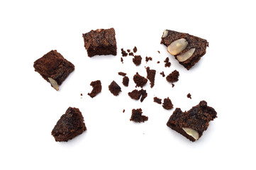 Chocolate brownie with sliced almond nuts toppings crumbs isolated on white background.