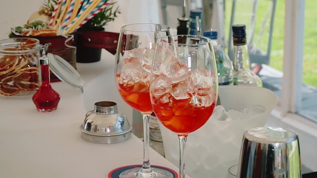 large cocktails with ice on a table on a light white background