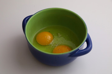 eggs in a bowl isolated on white background