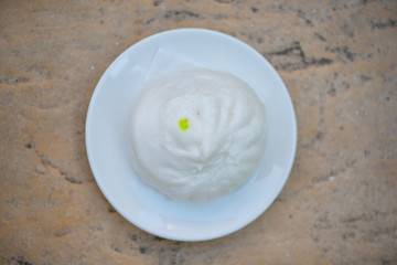 White steamed bun on white dish
