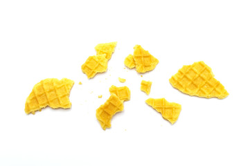 Naklejka premium Crumbs of waffle crisp butter flavor biscuits isolated on white background.