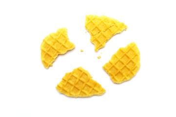 Crumbs of waffle crisp butter flavor biscuits isolated on white background.
