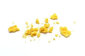 Crumbs of waffle crisp butter flavor biscuits isolated on white background.