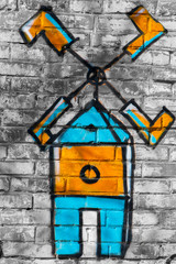 colorful drawing on a brick wall