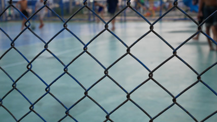 Fototapeta premium chain link fence with barbed wire