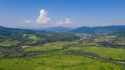 Aerial view of the Svalyava in Carpathian mountains. Natural background with geometric pattern -...