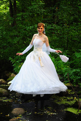 Obraz na płótnie Canvas bride in a white wedding dress