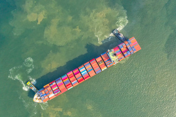 Container , container ship in export and import business and logistics. Shipping cargo to harbor by...