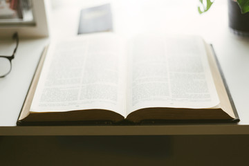 Fototapeta premium Selective focus of the holy bible with sunlight.