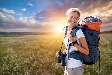 Travels female happy and smiling during a hike