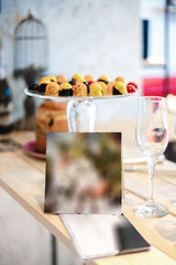 candies in multi-colored glaze lie on a glass stand