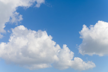 Blue background and huge clouds fluttering in the sky