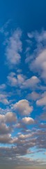 Obraz premium Fantastic clouds at sunrise, vertical panorama