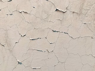 The texture is an old, cracked gray paint, battered by time.