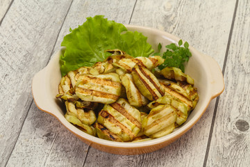 Grilled eggplant slices served basil
