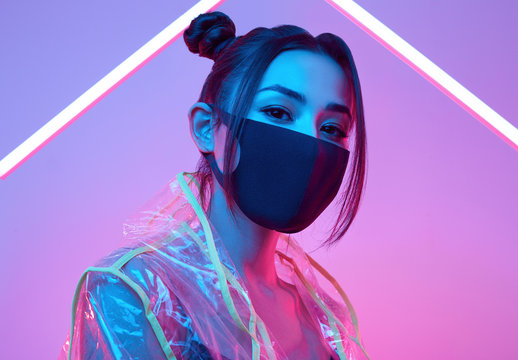 Virus mask Asian woman wearing face protection around colourful neon