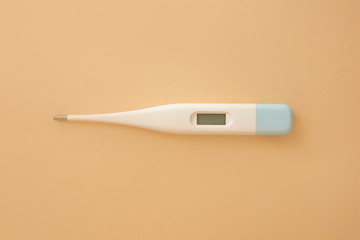 medical thermometer  on  beige background