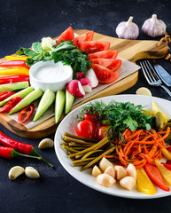 set of appetizers of fresh and pickled vegetables