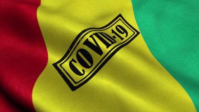 Covid-19 stamp on the flag of Guinea. Coronavirus concept