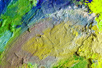 Background image of bright oil-paint palette closeup