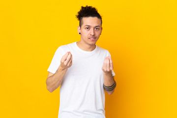 Caucasian man over isolated background making money gesture but is ruined