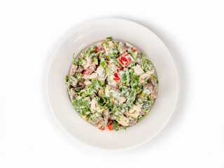 Salad of tomatoes, chicken breast, mushrooms and green onions in a gravy on a white background