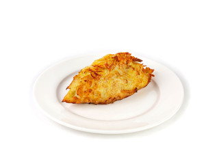 Appetizing piece of juicy chicken breast baked in batter on a white plate
