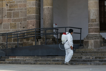 Mexican Volunteers wear protective gear while disinfecting downtown Guadalajara to help fight coronavirus disease (COVID-19)