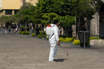 Mexican Volunteers wear protective gear while disinfecting downtown Guadalajara to help fight coronavirus disease (COVID-19)
