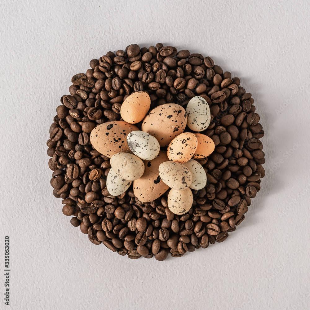 Wall mural creative flat lay composition with easter eggs and coffee roasted beans. pastel colors and soft shad