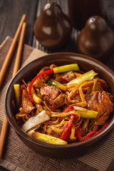 Rice noodles with chicken, soy and vegetables, asian cuisine.