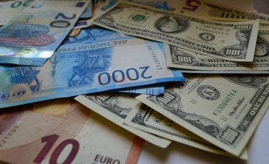 Paper money rubles, dollars and euros.