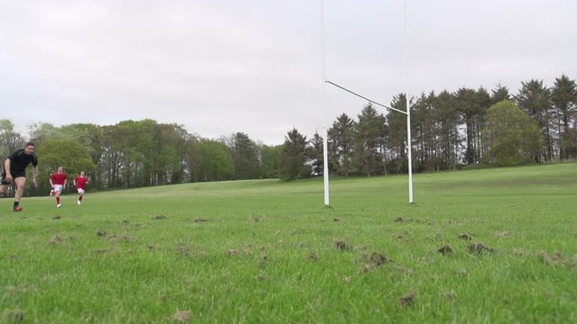 Scoring a try in Rugby. Action from a match resulting in one of the teams getting the ball over the line. Slow motion. Stock Video Clip Footage