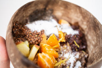 Bowls of oatmeal with berries and fruits