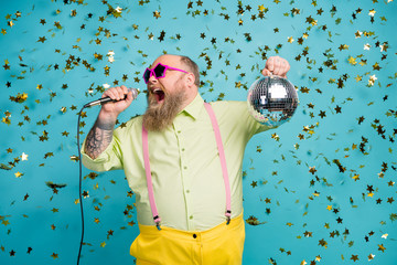 Portrait of his he nice attractive cheerful bearded mature guy holding in hand disco ball having...