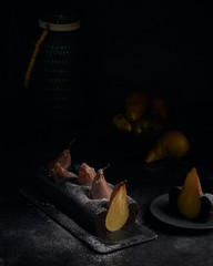 Vegan brownie chocolate loaf cake with pear autumn homemade baked pastry dessert gourmet food on black background.