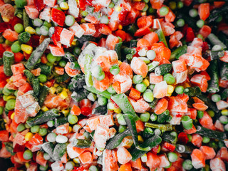 A mixture of frozen vegetables shot from above in a supermarket.