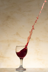 Red wine splash on a cristal glass