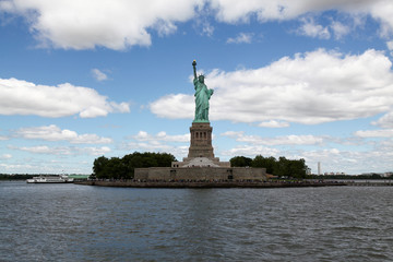 Obraz na płótnie Canvas New york ,USA-June 15 ,2018:Tourist visit in front of the Statue of liberty is American landmark have famous in New York ,USA .